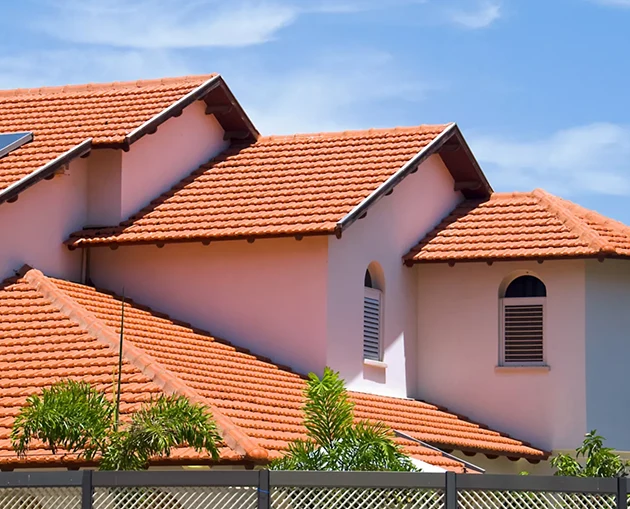 Newly repaired roof after storm damage with clean shingles and flashing